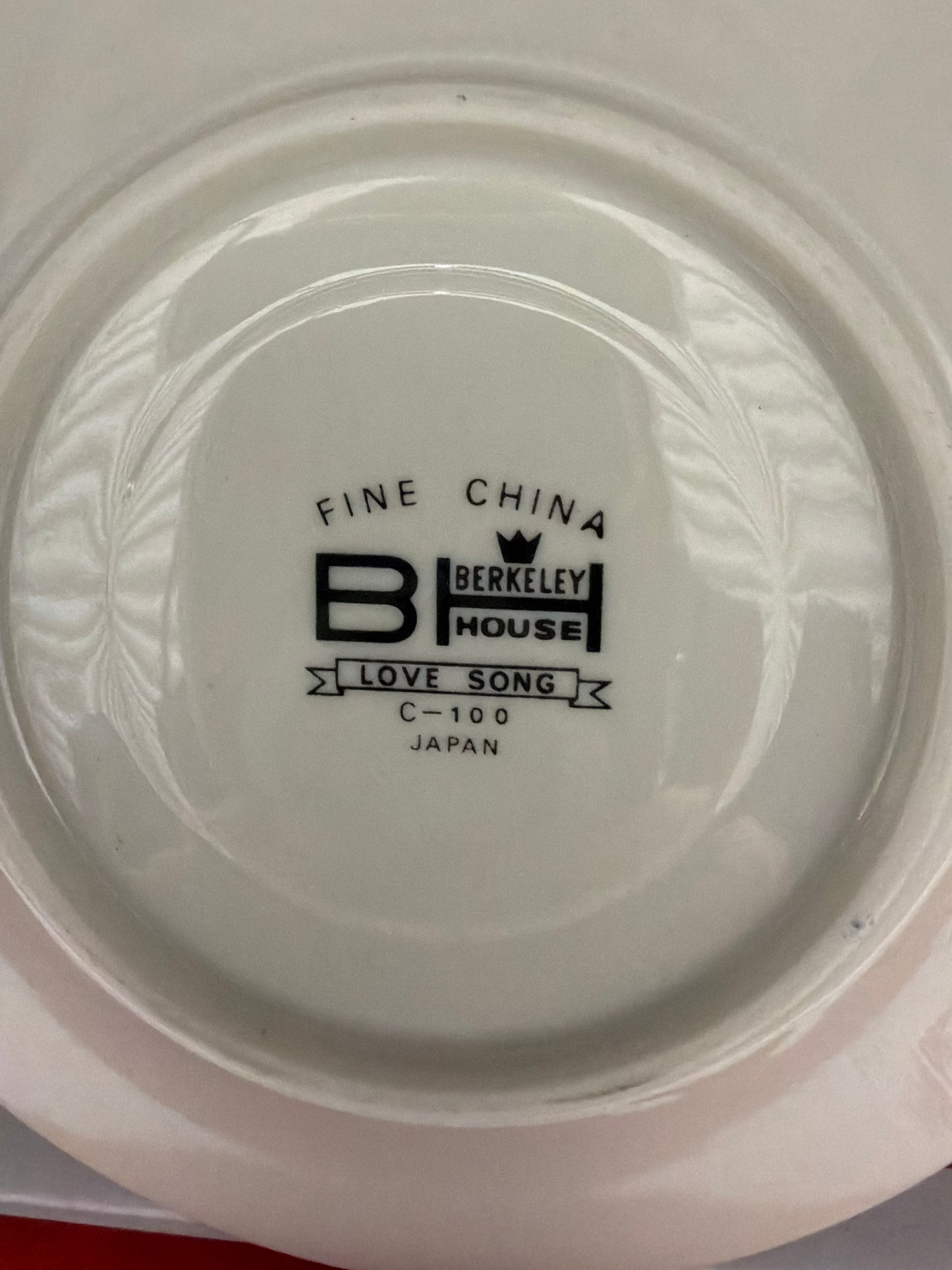 Back of a white plate with 'Berkeley House' branding