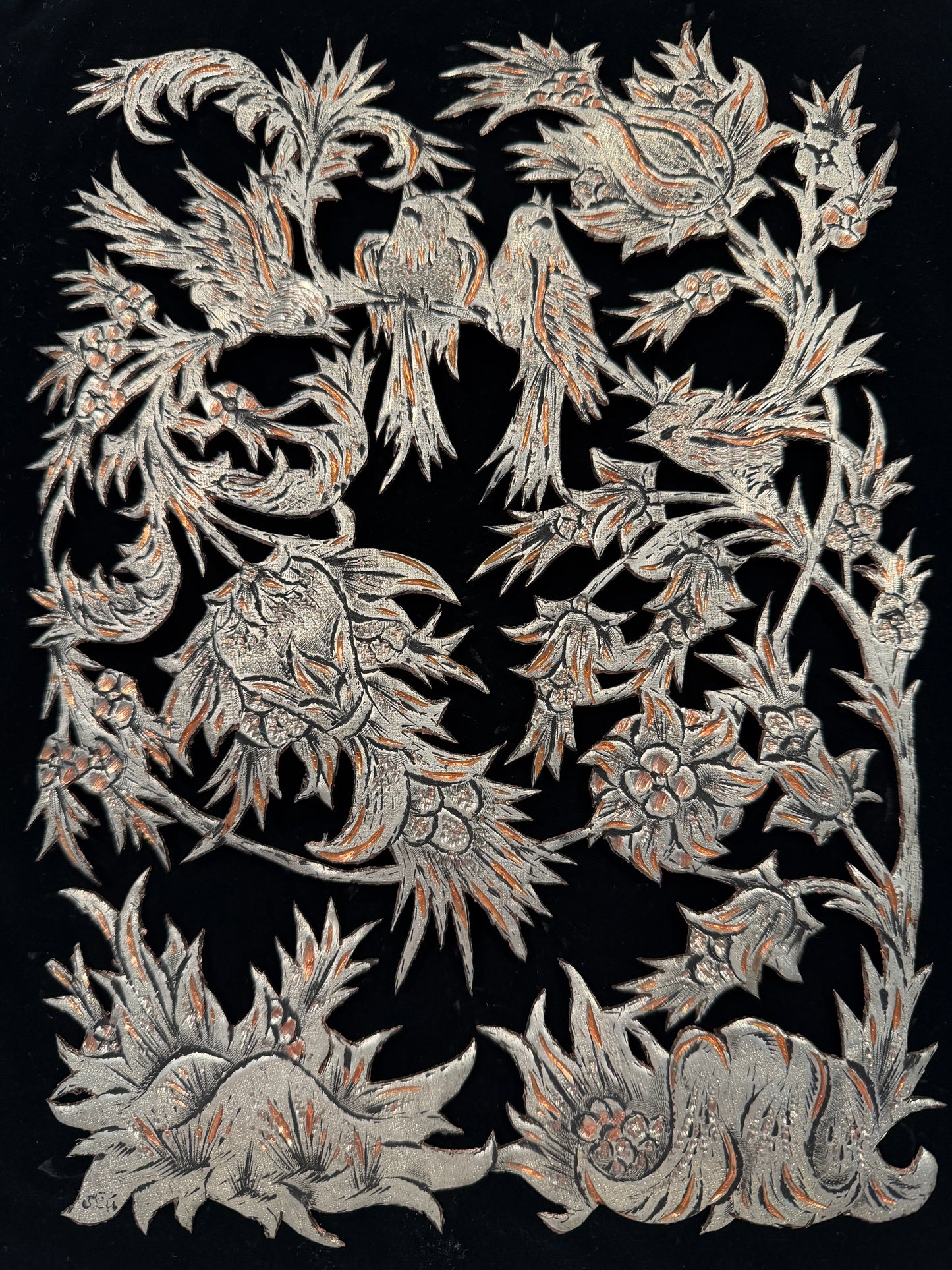 Decorative pattern with intricate designs on a black background