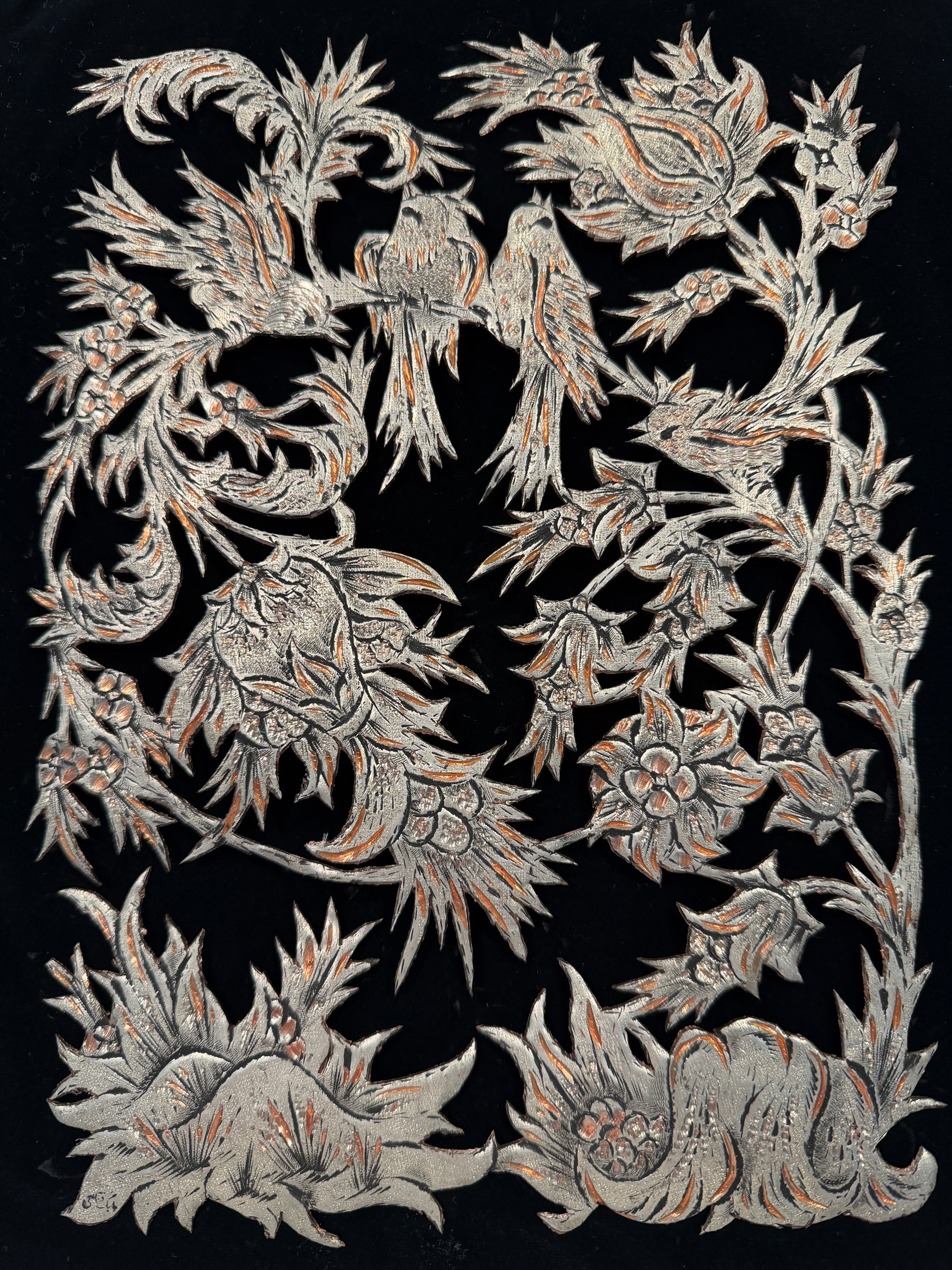 Decorative pattern with intricate designs on a black background