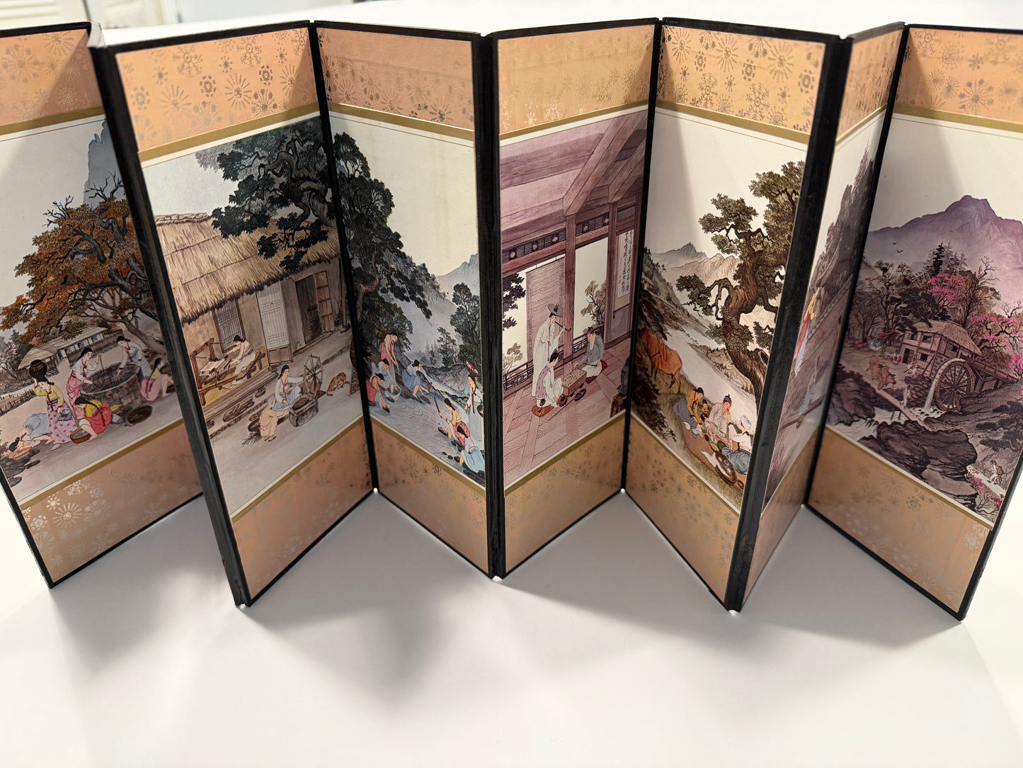 Traditional Chinese folding screen with artistic scenes 