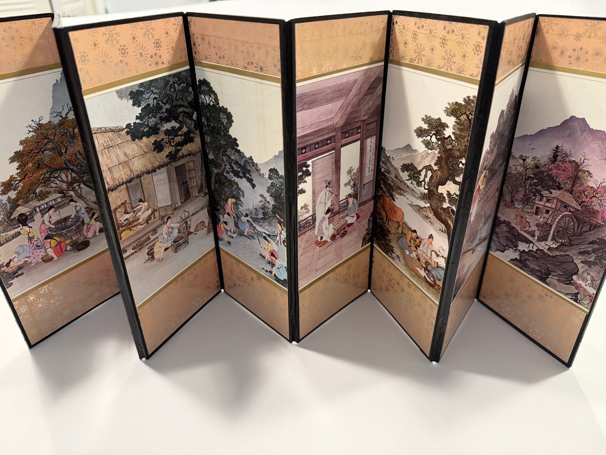 Traditional Chinese folding screen with artistic scenes 