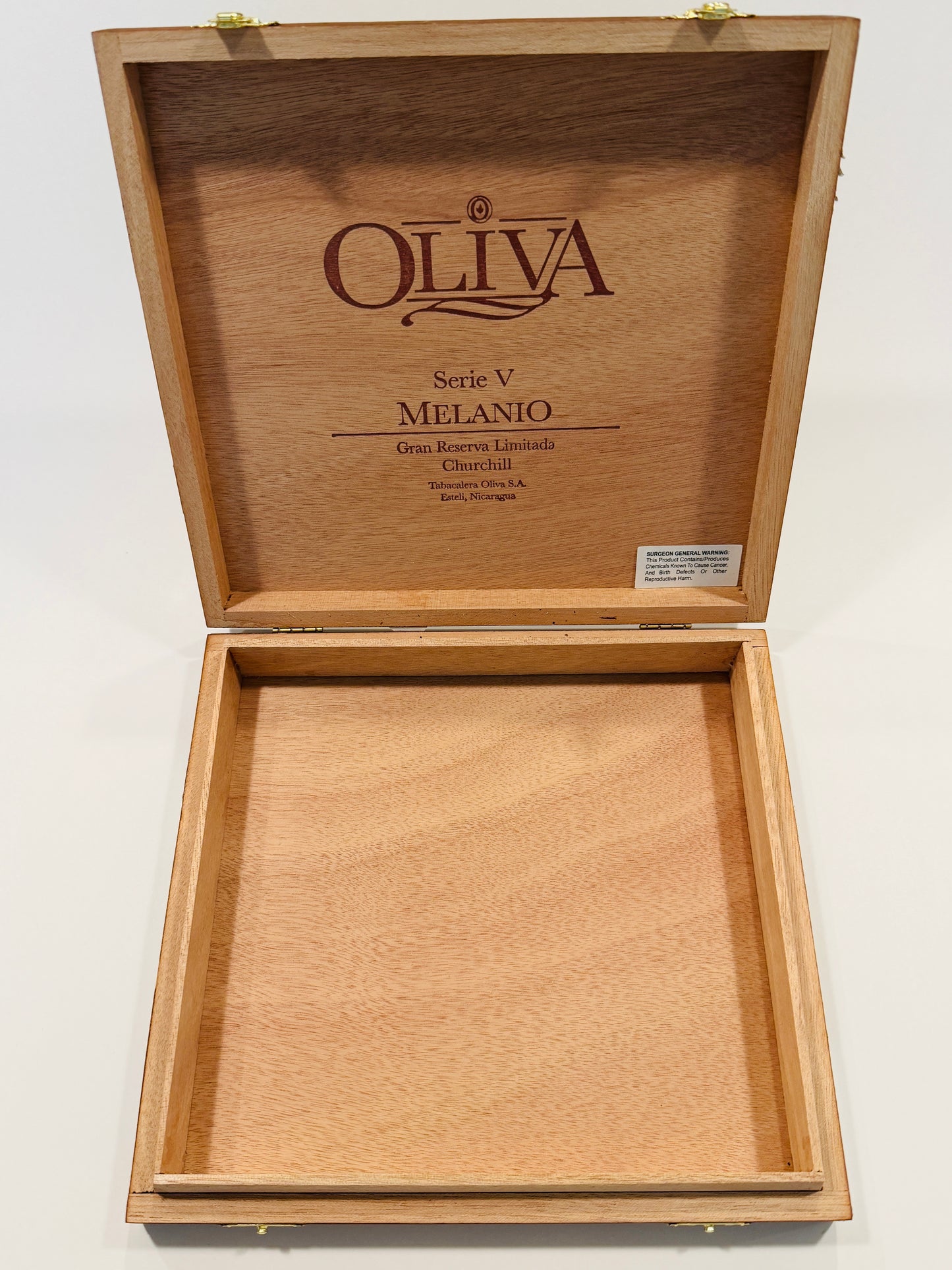 Wooden cigar box with 'Oliva' branding on a white background