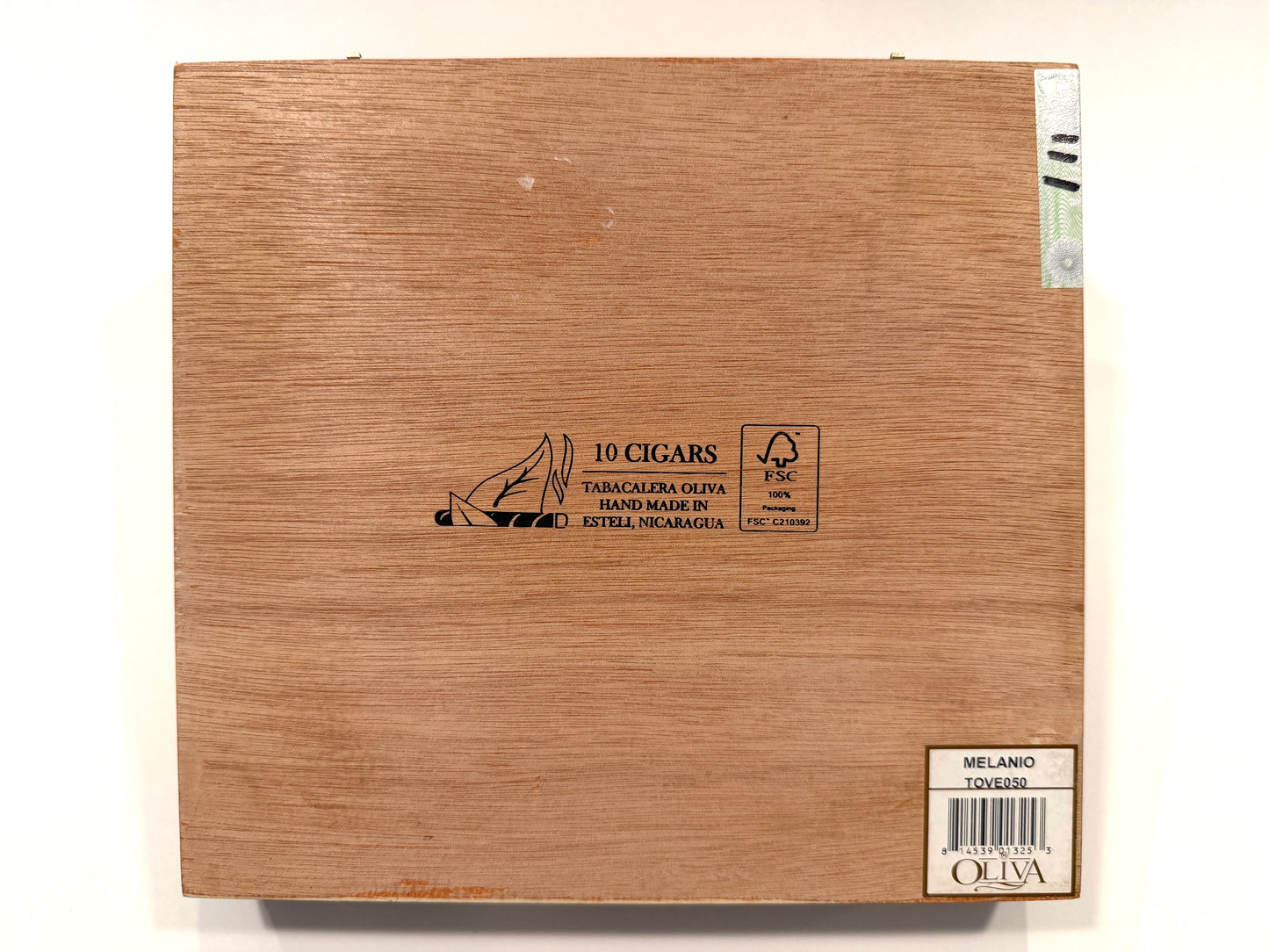 Wooden cigar box with brand and product information on a white background