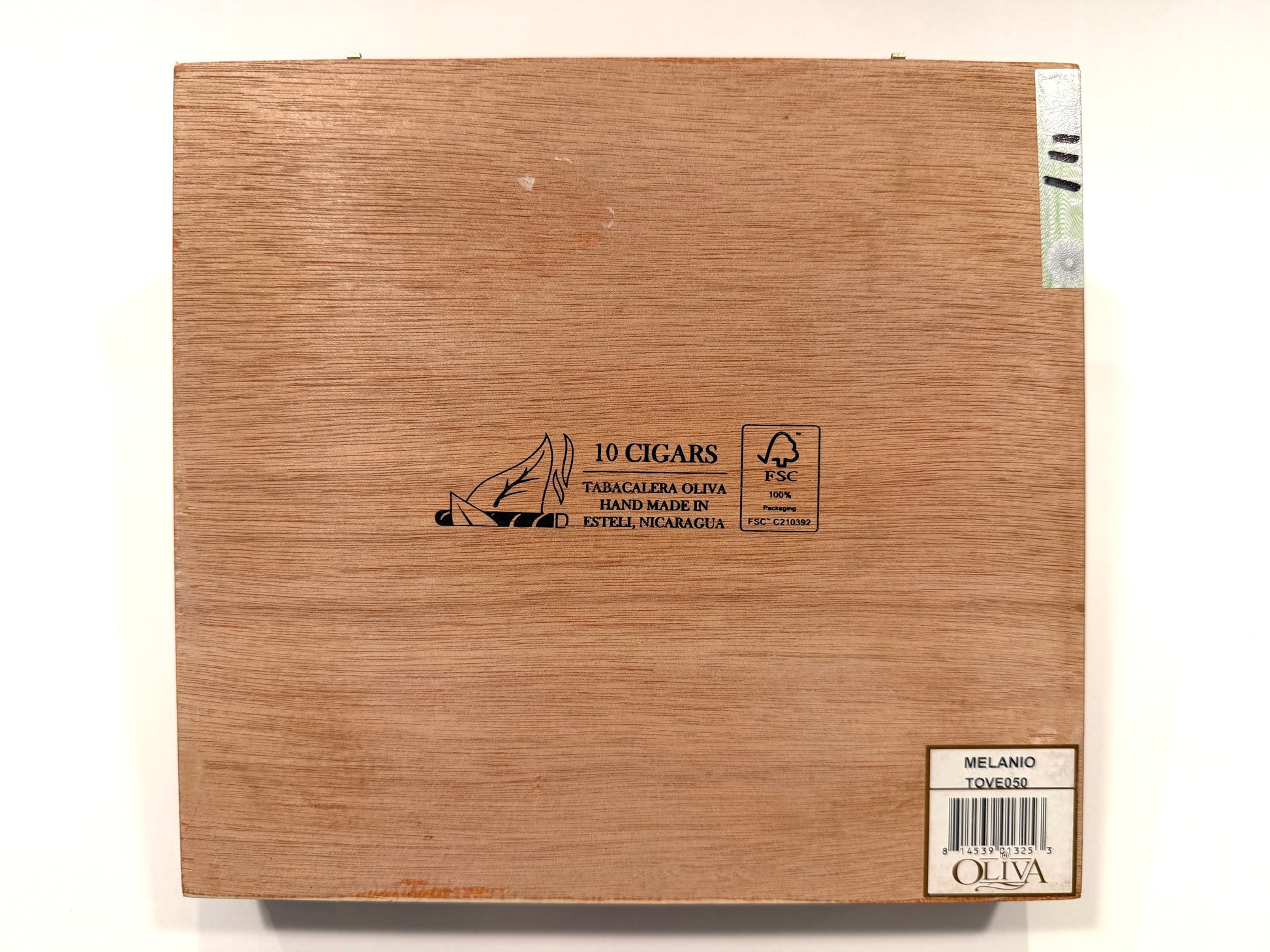 Wooden cigar box with brand and product information on a white background