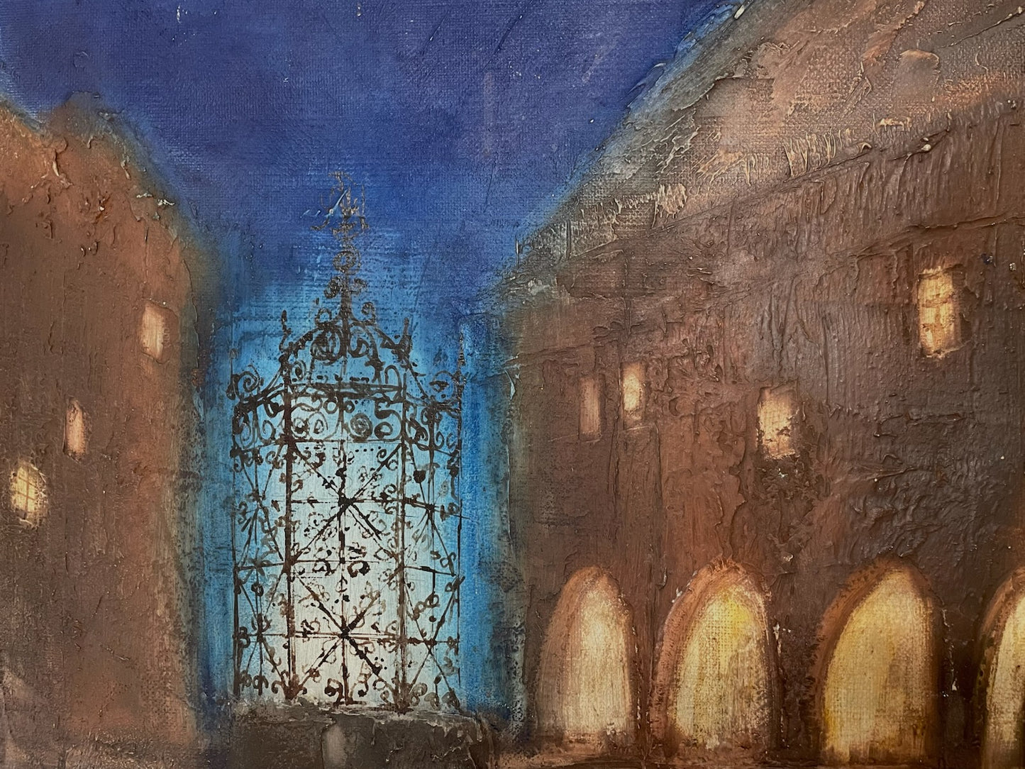 Painting of a city street with a large ornate gate in the center, under a blue sky Signed Ivo Soukup 66