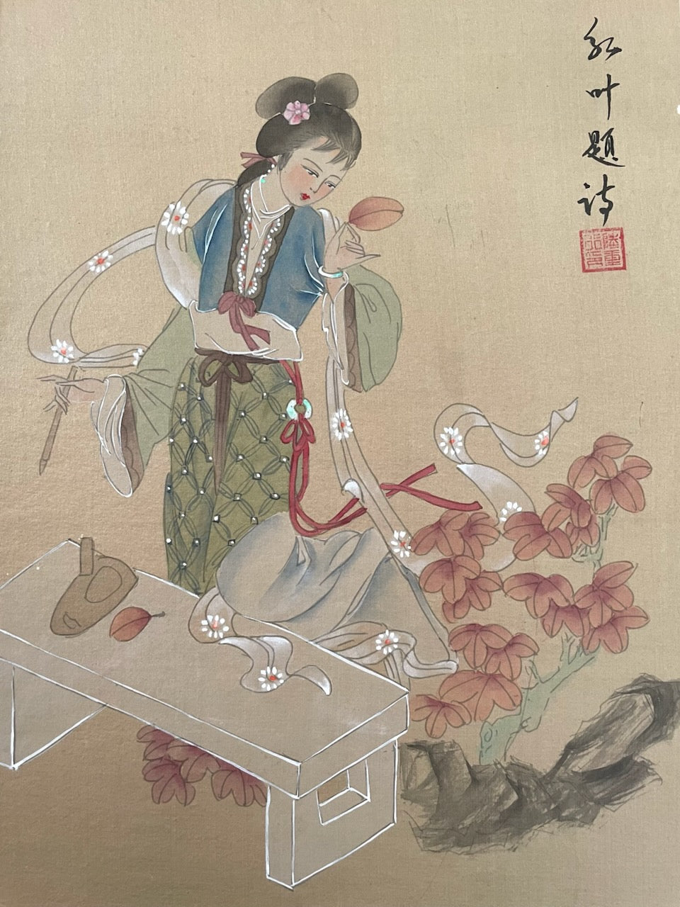 Signed Traditional Chinese painting of a woman holding a leaf with floral elements.