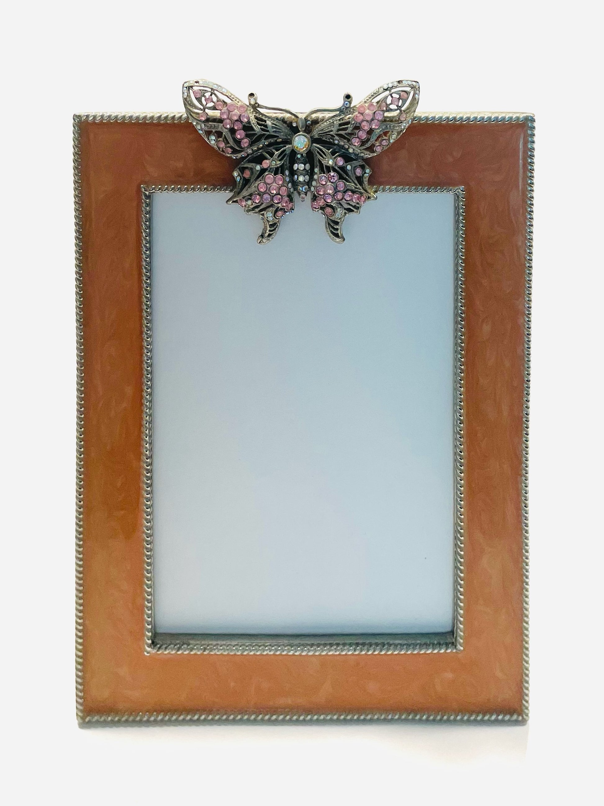 Decorative photo frame with a butterfly embellishment 