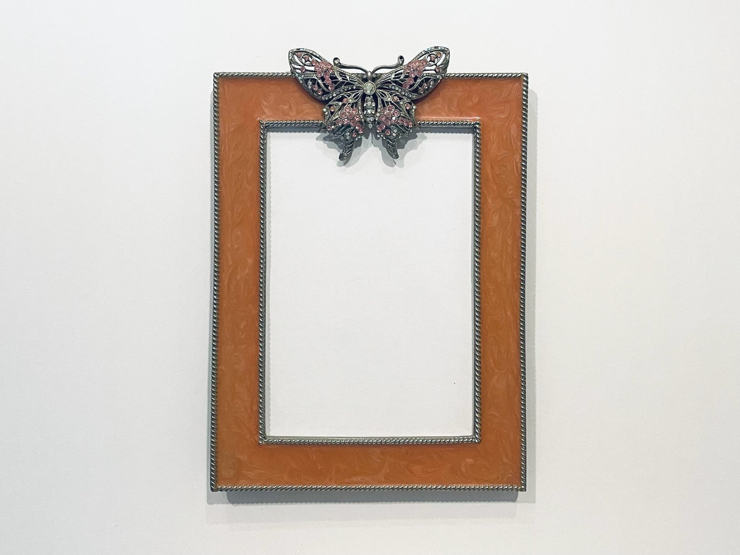 Decorative picture frame with a butterfly design 