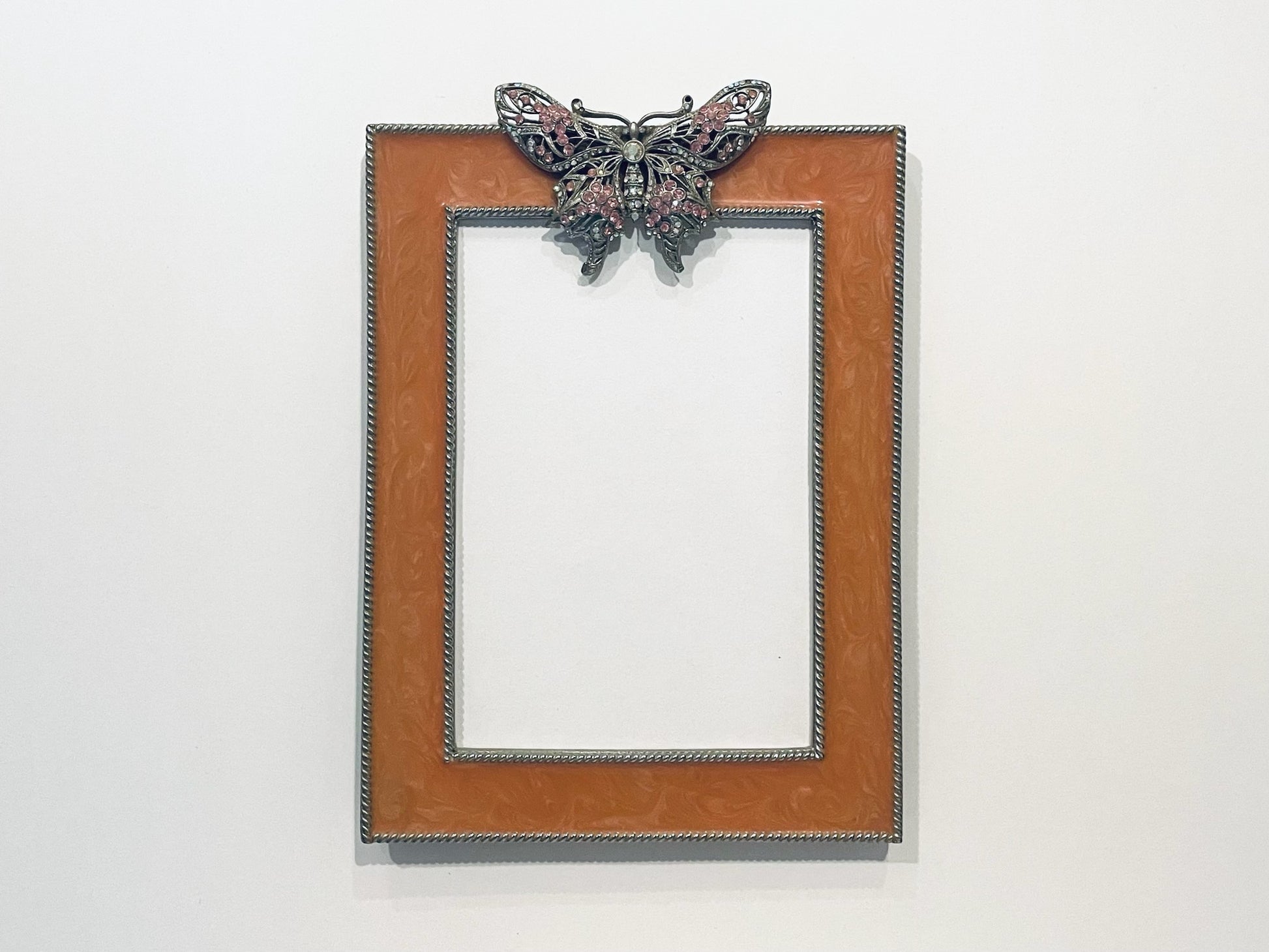 Decorative picture frame with a butterfly design 