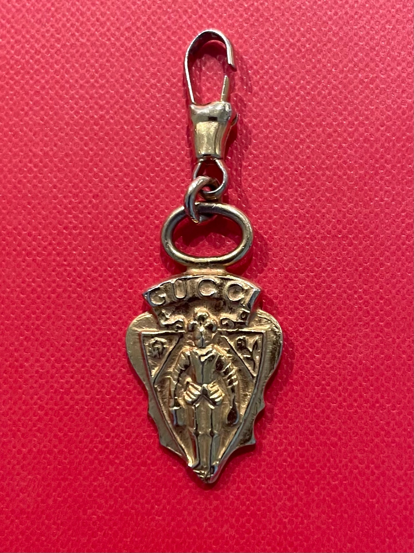 A Vintage Gucci Gold Tone Armour Knight Pendant Charm