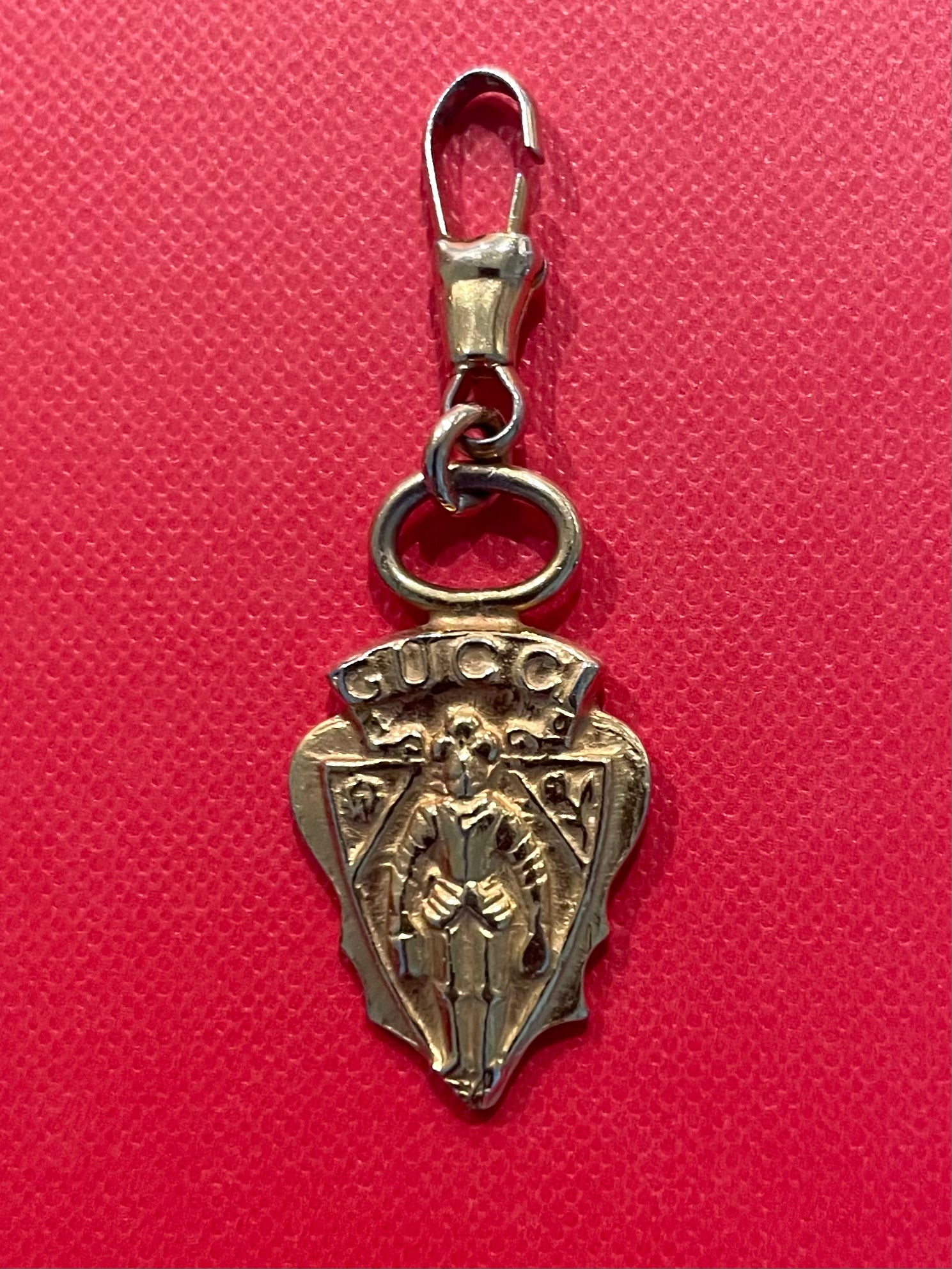 A Vintage Gucci Gold Tone Armour Knight Pendant Charm