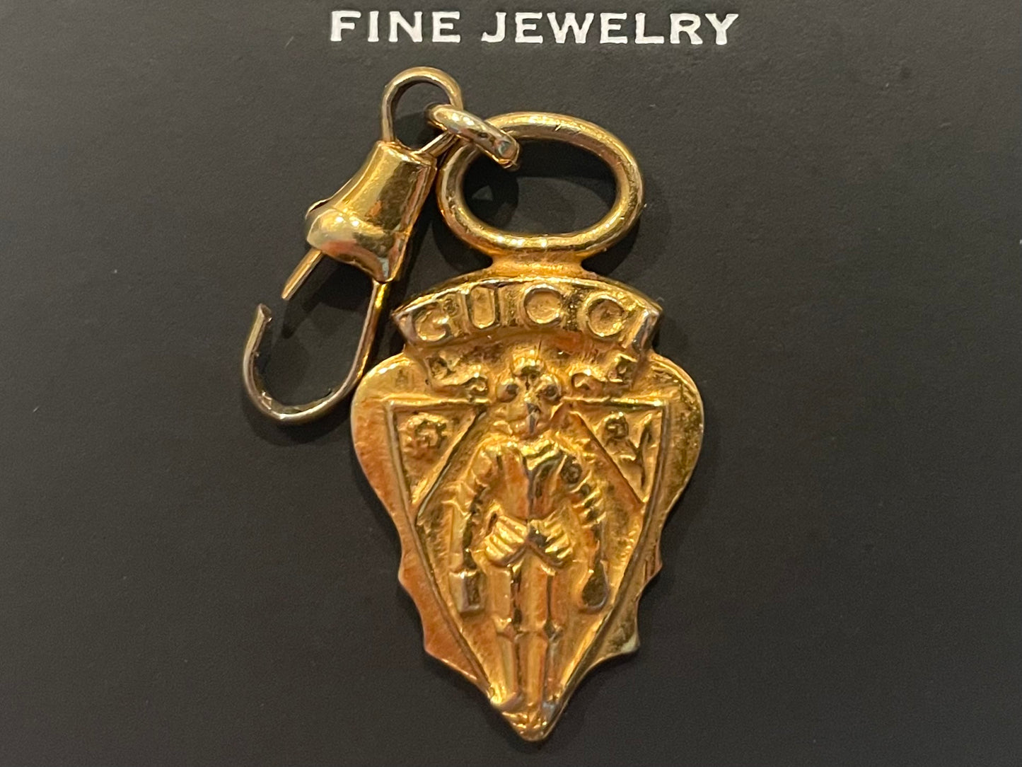 A Vintage Gucci Gold Tone Armour Knight Pendant Charm