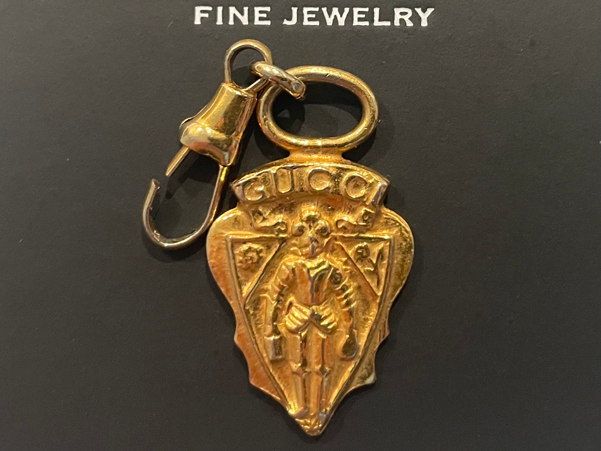 A Vintage Gucci Gold Tone Armour Knight Pendant Charm