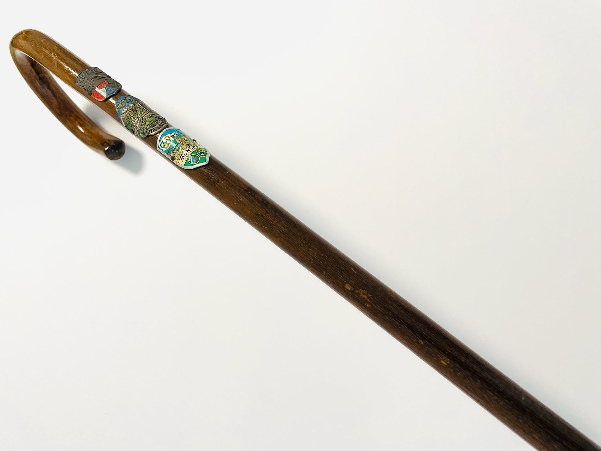 Decorative walking stick with a wooden handle featuring Olympic of Munich  Enameled Shields 