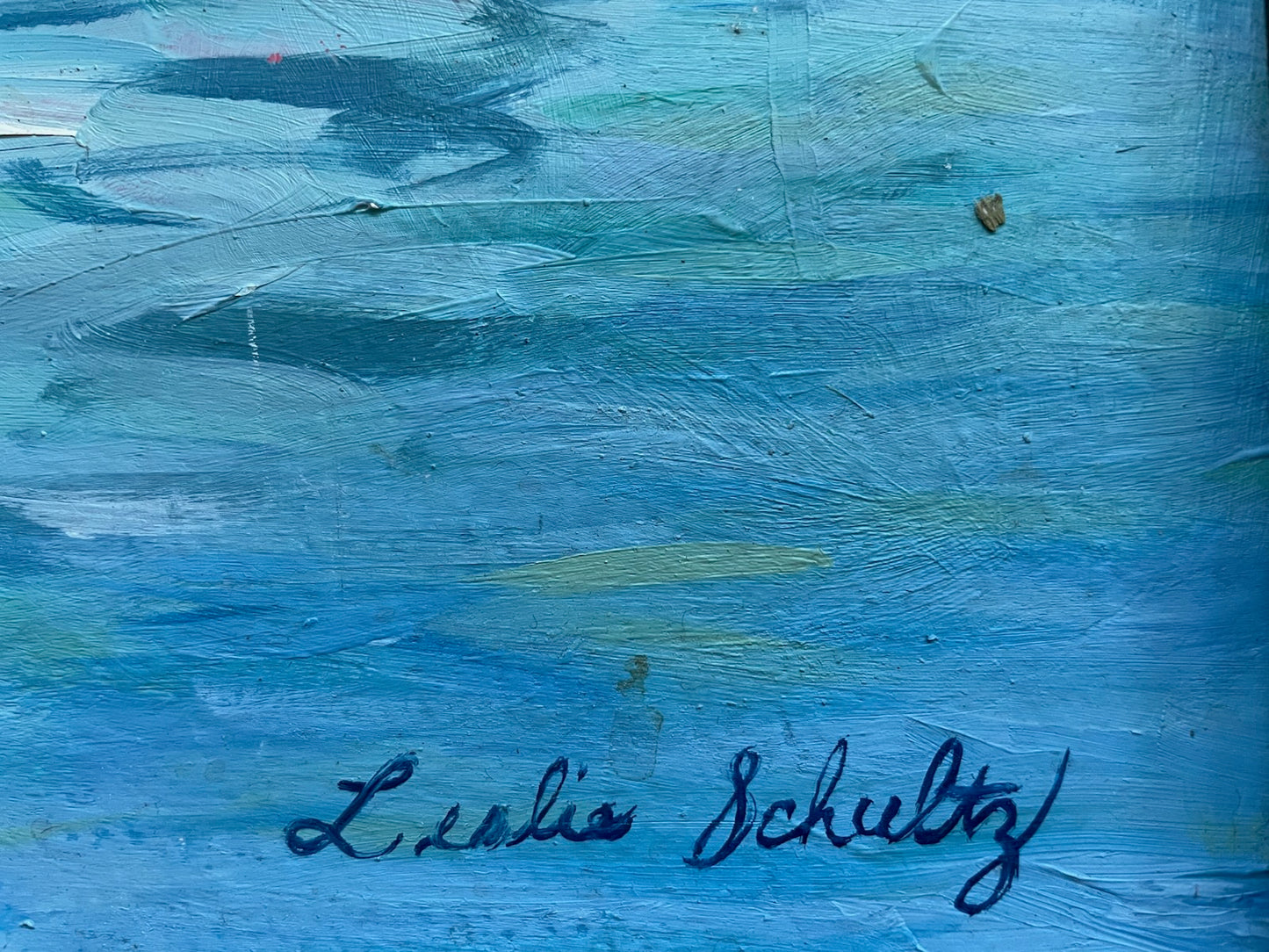 Blue textured painting with a signature at the bottom right corner