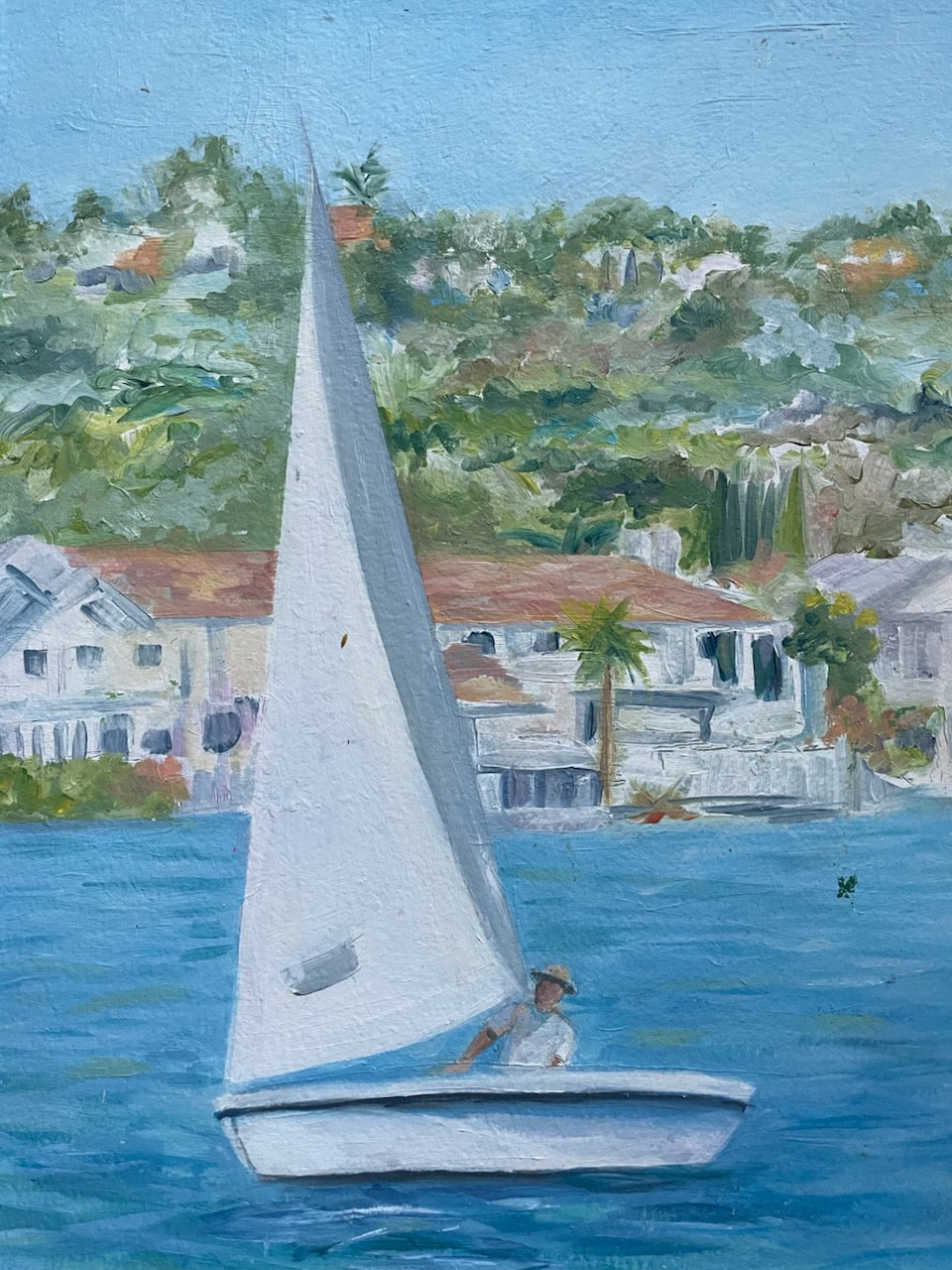 Leslie Schultz Sailing scene with sailboats on a body of water, with houses and trees in the background oil on canvas 