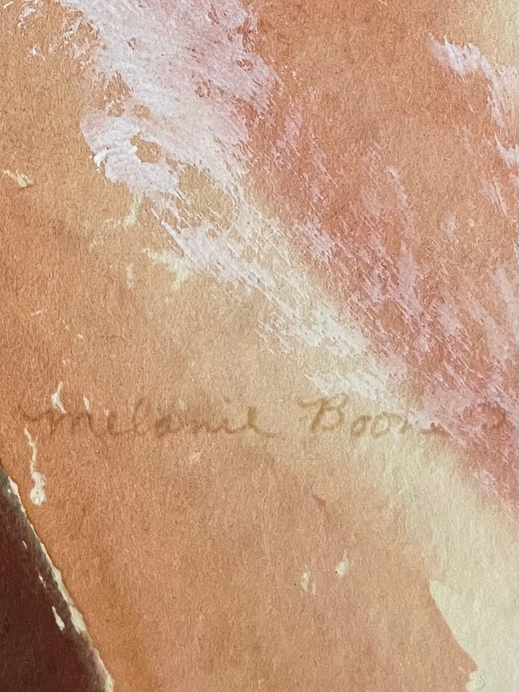 Close-up of a textured surface with a signature in the corner