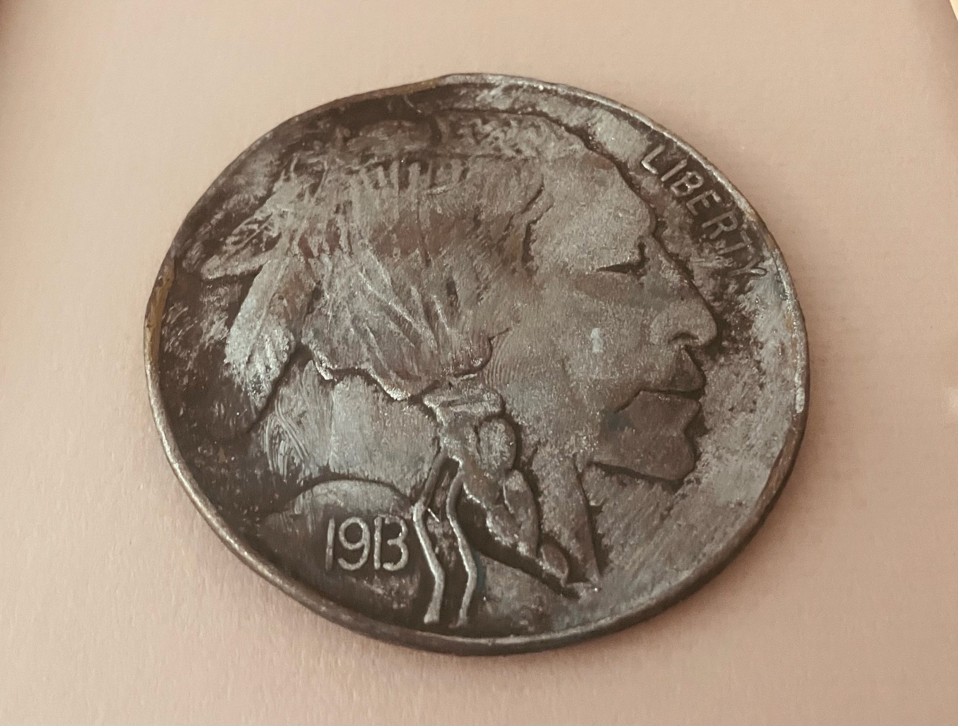 Buffalo nickel coin with 'Liberty' and '1913' inscriptions  