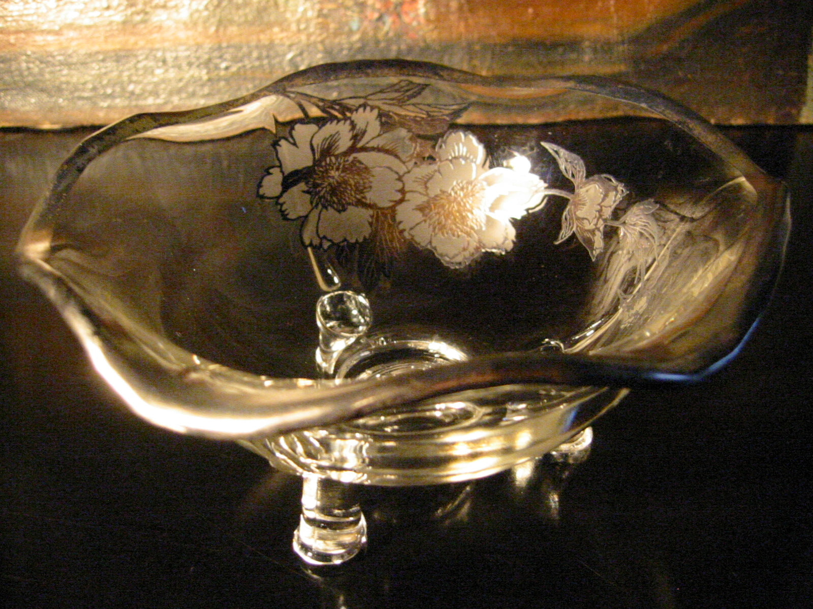 Decorative glass bowl with silver floral design 