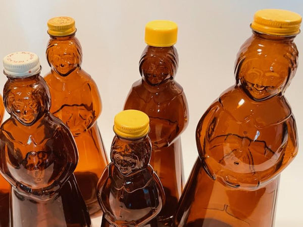 Aunt Jemima Various Sizes Six Brown Glass Bottles Caps Relief Marked