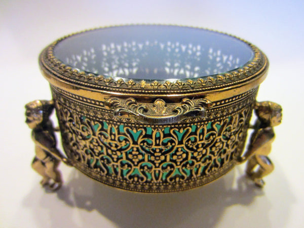 Brass Filigree Round Jewelry Box Beveled Glass Lid Footed Putti