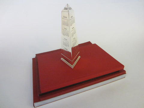 Obelisk Nickel Paperweight 2006 Calendar Neiman Marcus Exclusive - Designer Unique Finds 