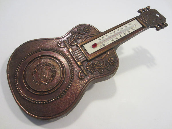 A Copper Vintage Guitar Thermometer